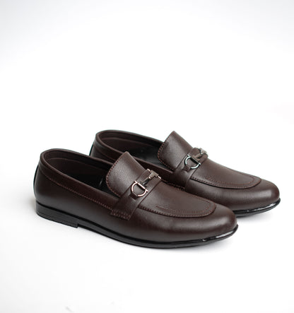 Pair of brown loafers on a white background