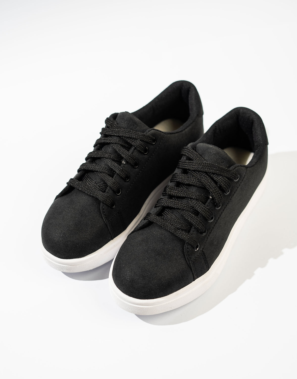 Black sneakers on a white background