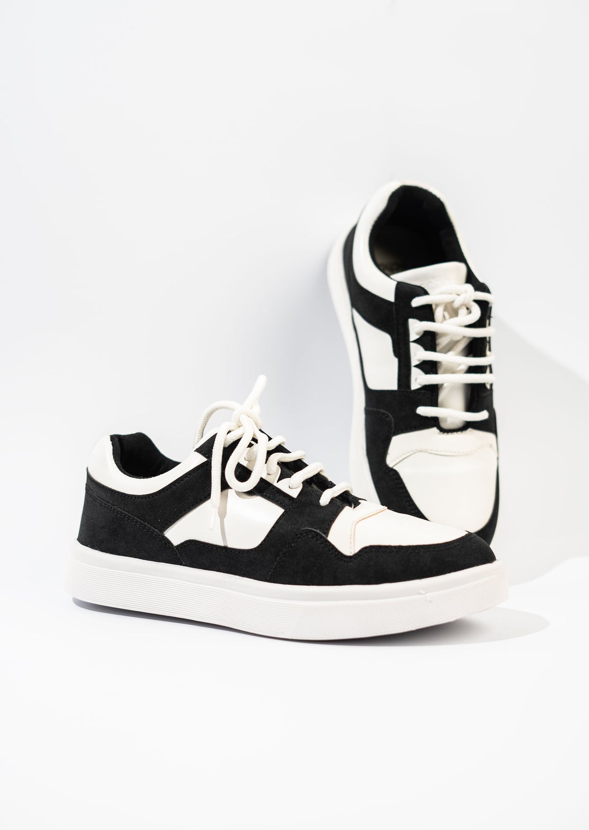 Black and white sneakers on a white background
