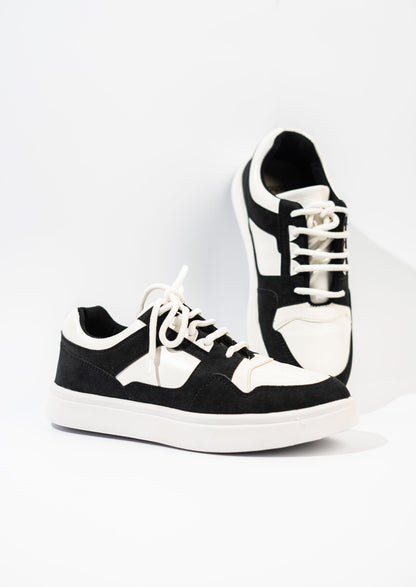 Black and white sneakers on a white background