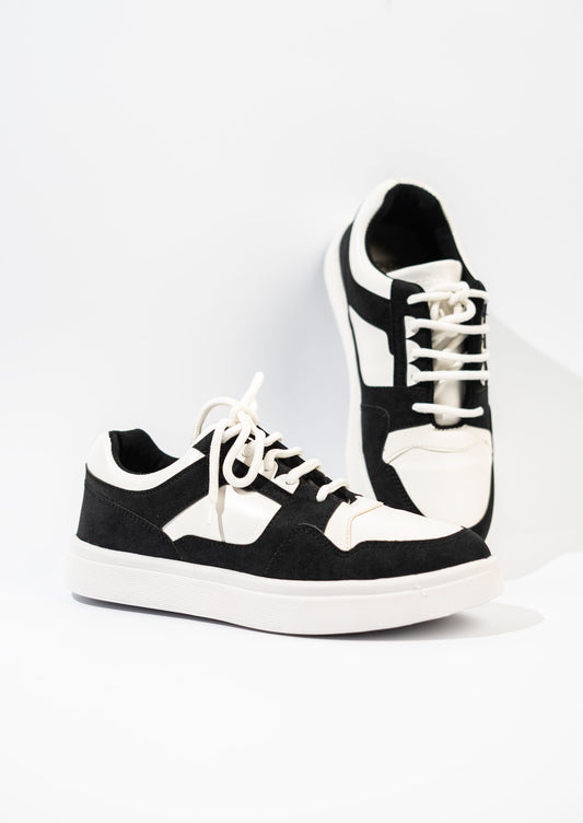 Black and white sneakers on a white background