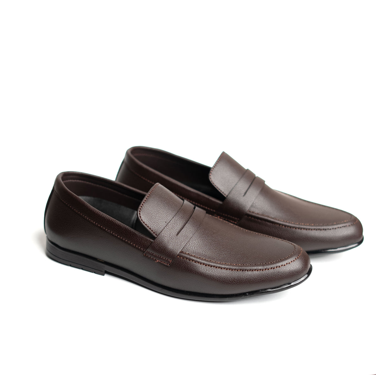 Pair of brown loafers on a white background