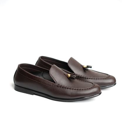 Pair of brown loafers with a tassel on a white background