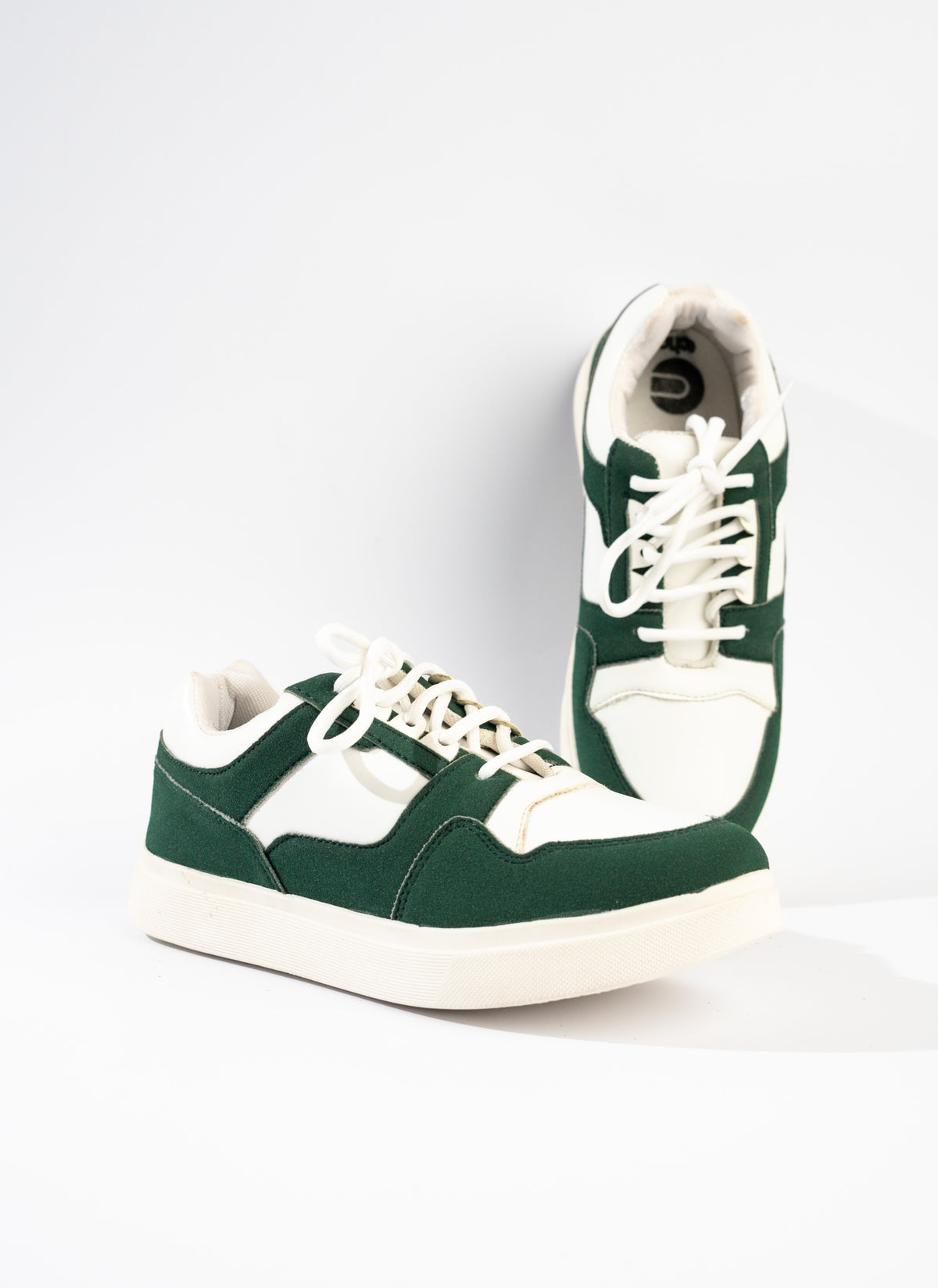 Green and white sneakers on a white background