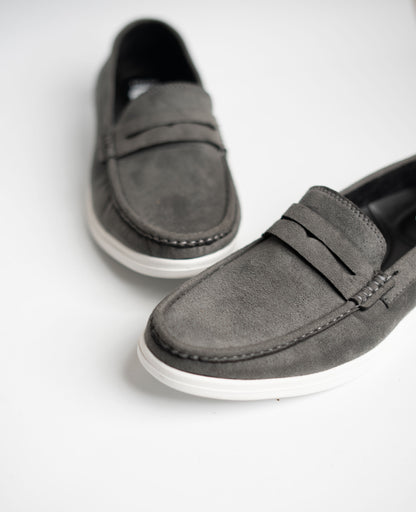 Pair of gray loafers on a white background