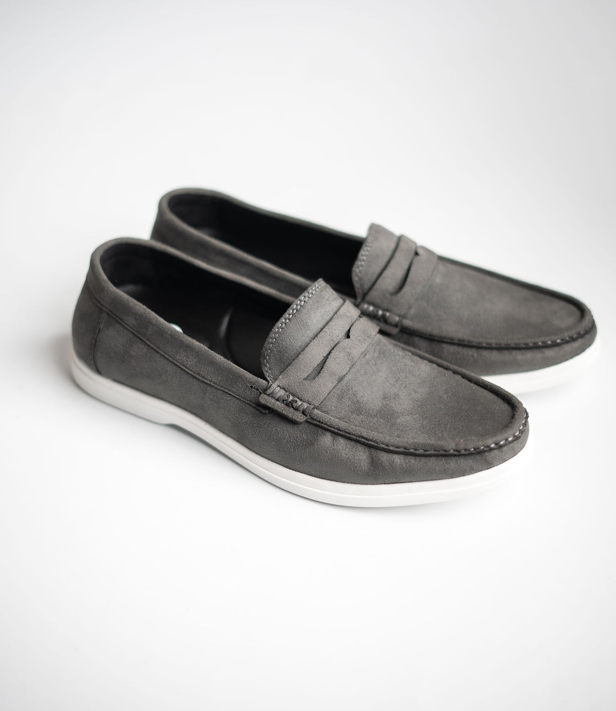 Pair of gray loafers on a white background