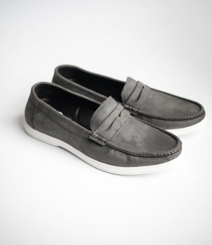 Pair of gray loafers on a white background