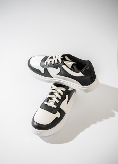 Black and white sneakers on a light gray background