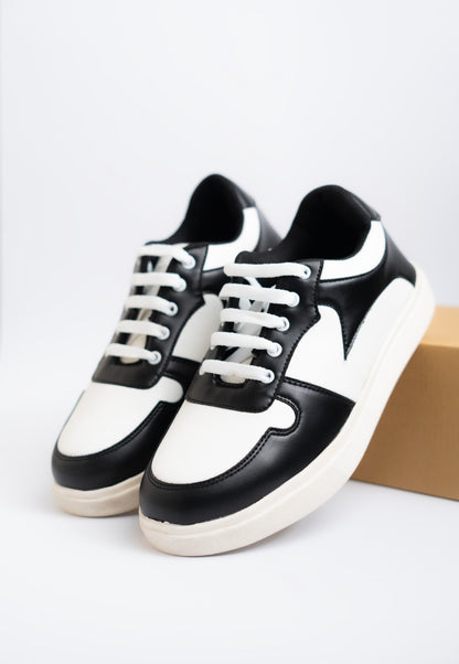 Black and white sneakers on a light gray background