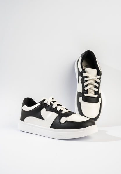 Black and white sneakers on a light gray background