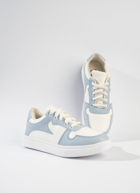 Pair of light blue and white sneakers on a white background