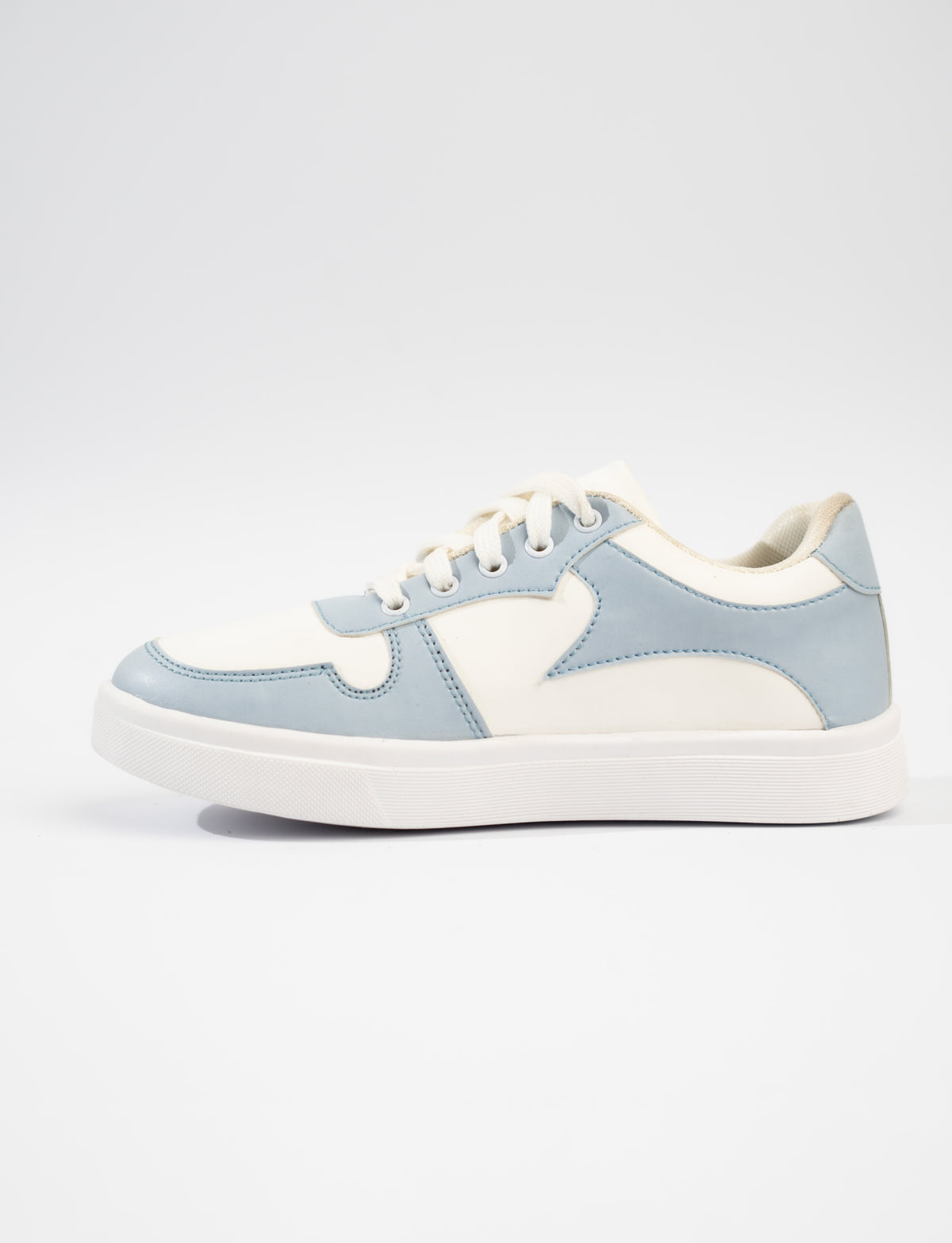 Light blue and white sneaker on a light gray background