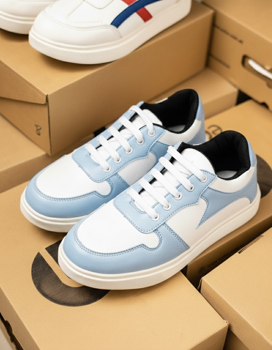 Blue and white sneakers on top of cardboard boxes