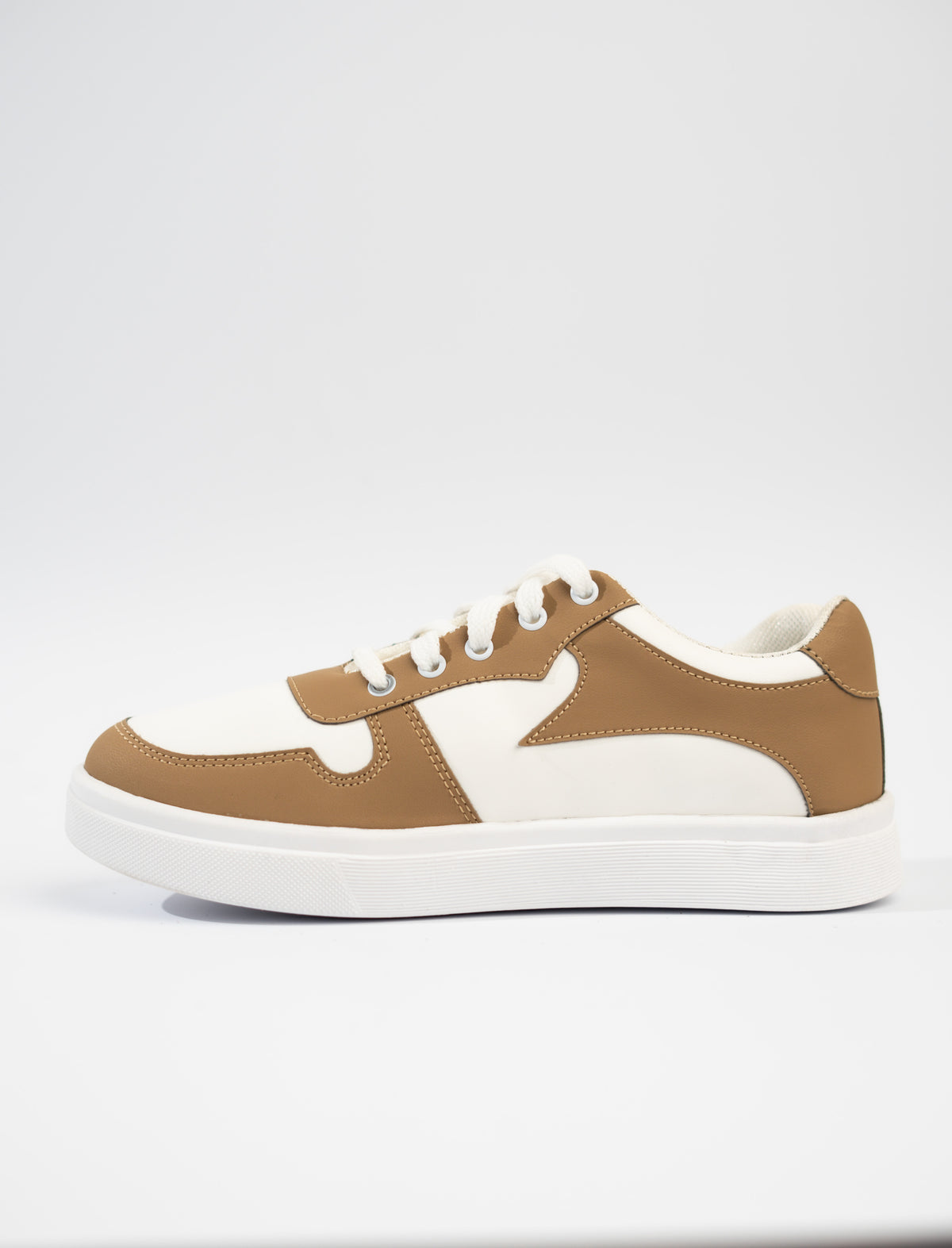 cream and white sneaker on a white background