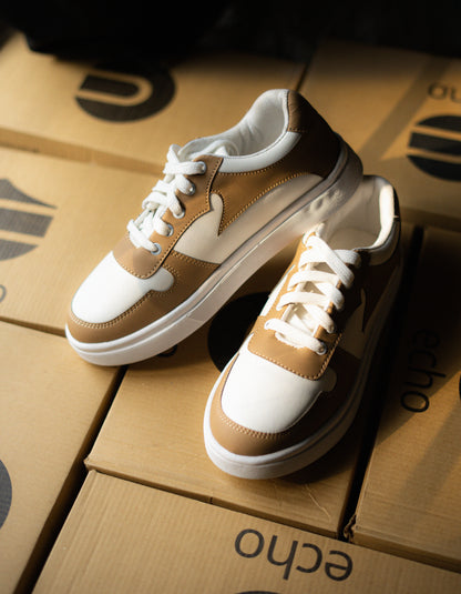 cream and white sneakers on a cardboard box with 'echo' branding.