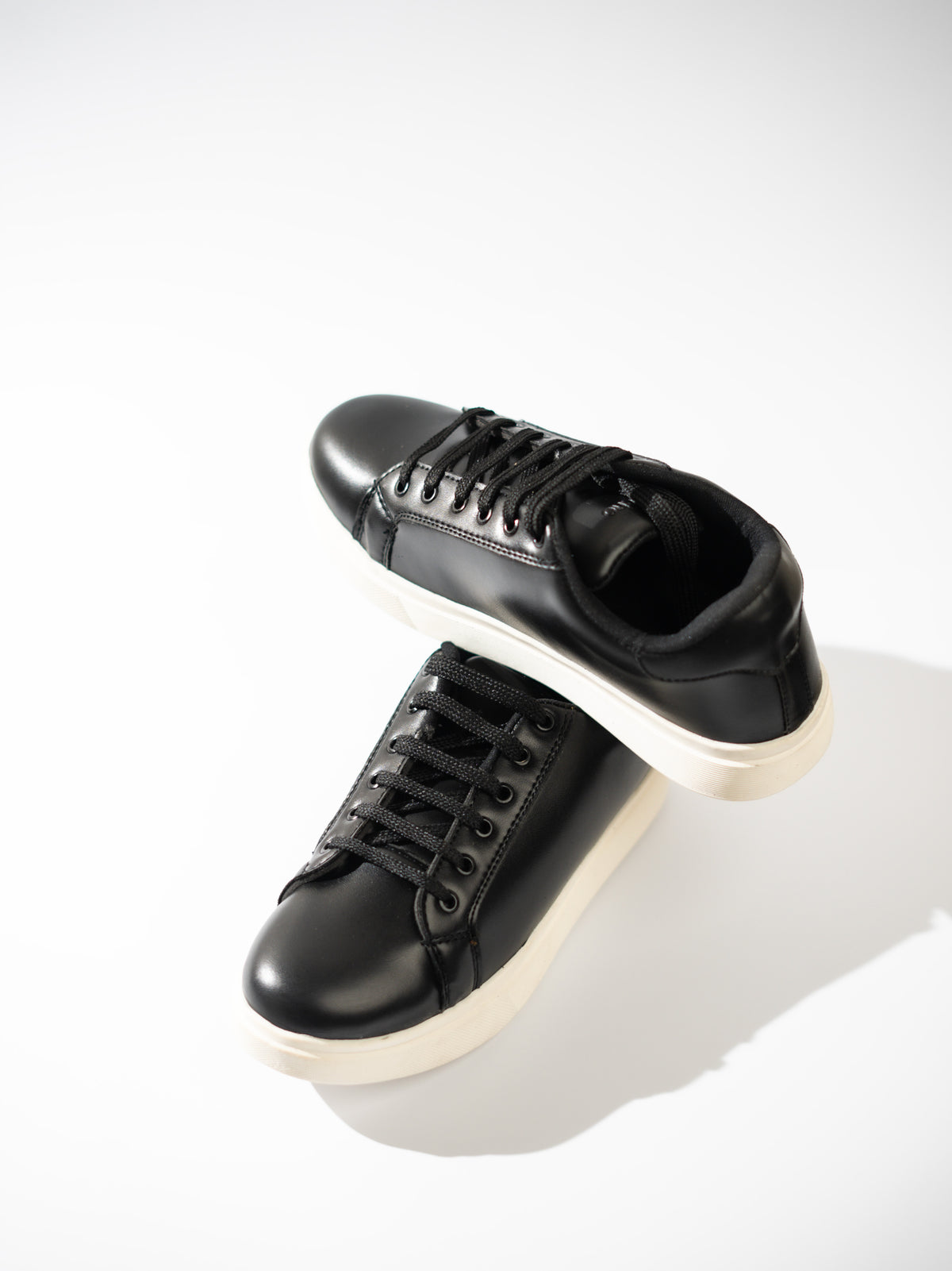 Black sneakers on a white background