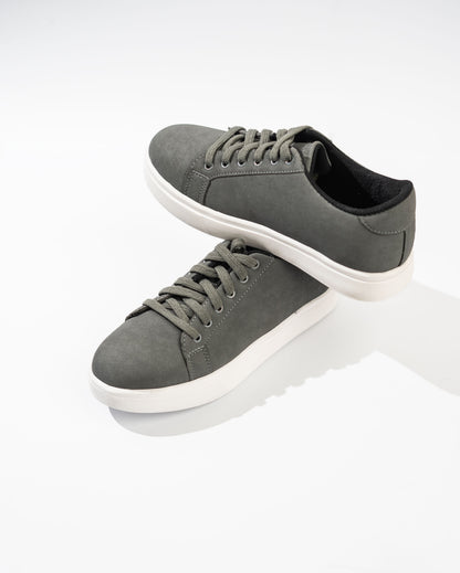 Gray sneakers with white soles on a white background