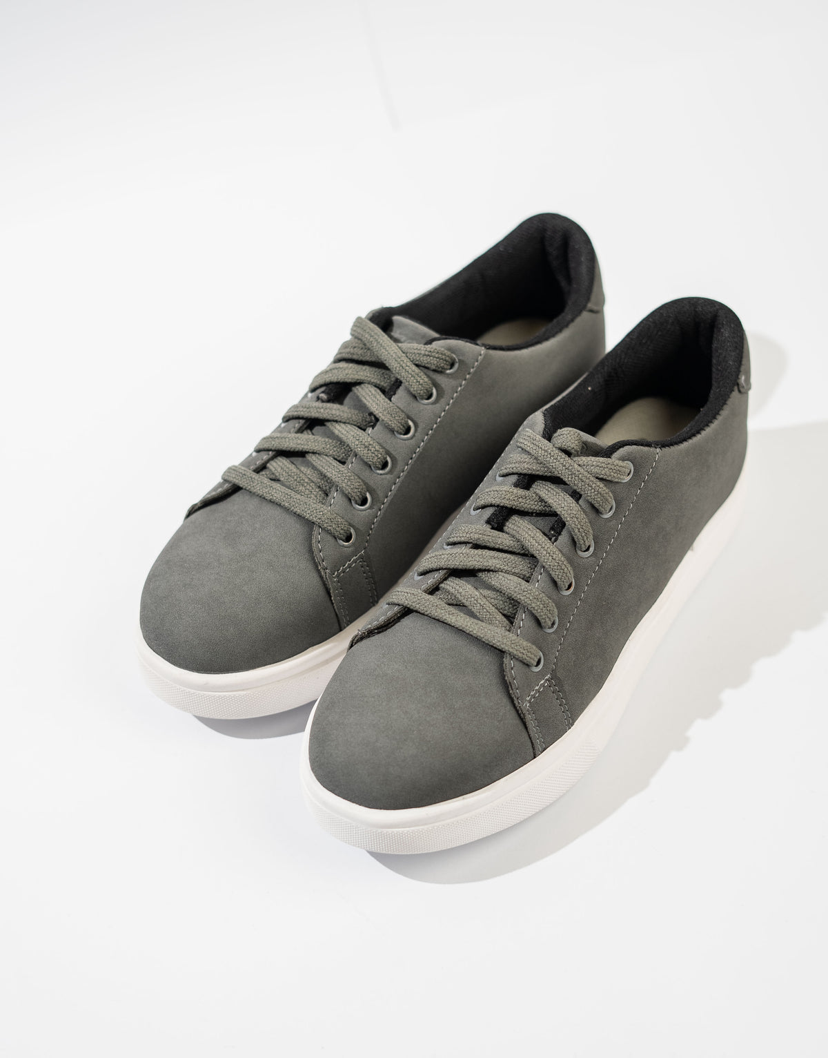 Pair of gray sneakers on a white background