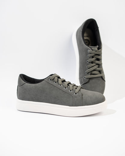 Gray sneakers with white soles on a white background