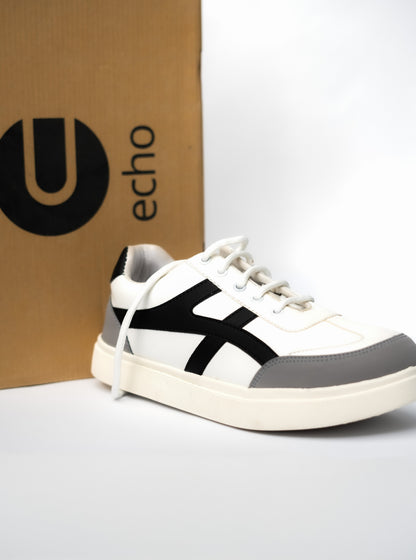 White and gray sneaker with black accents in front of an 'echo' branded box.